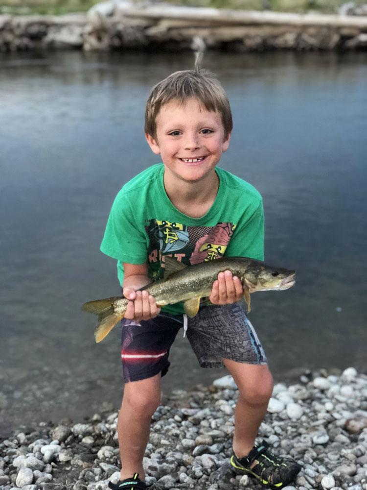 boy holding fish