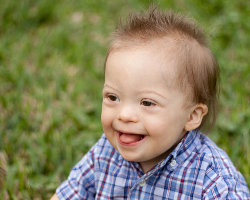 boy with Down syndrome smiling