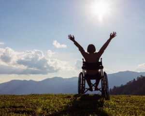 child in wheelchair enjoying the mountains