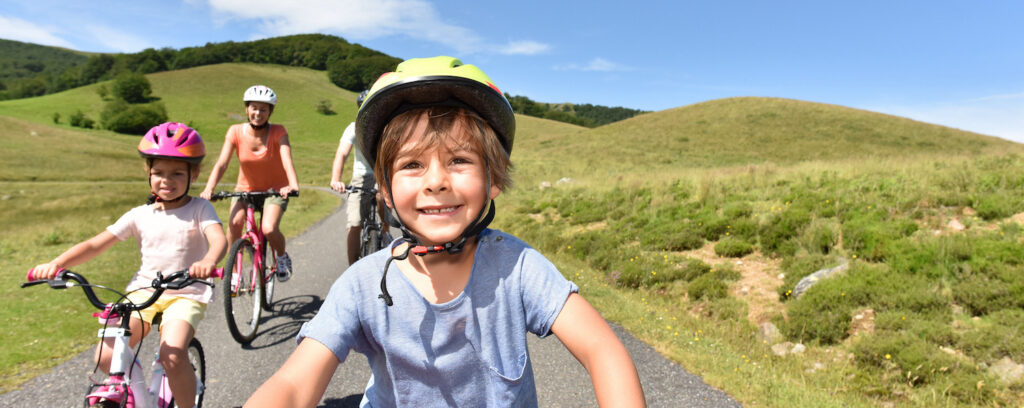 mountain kids riding bike with family